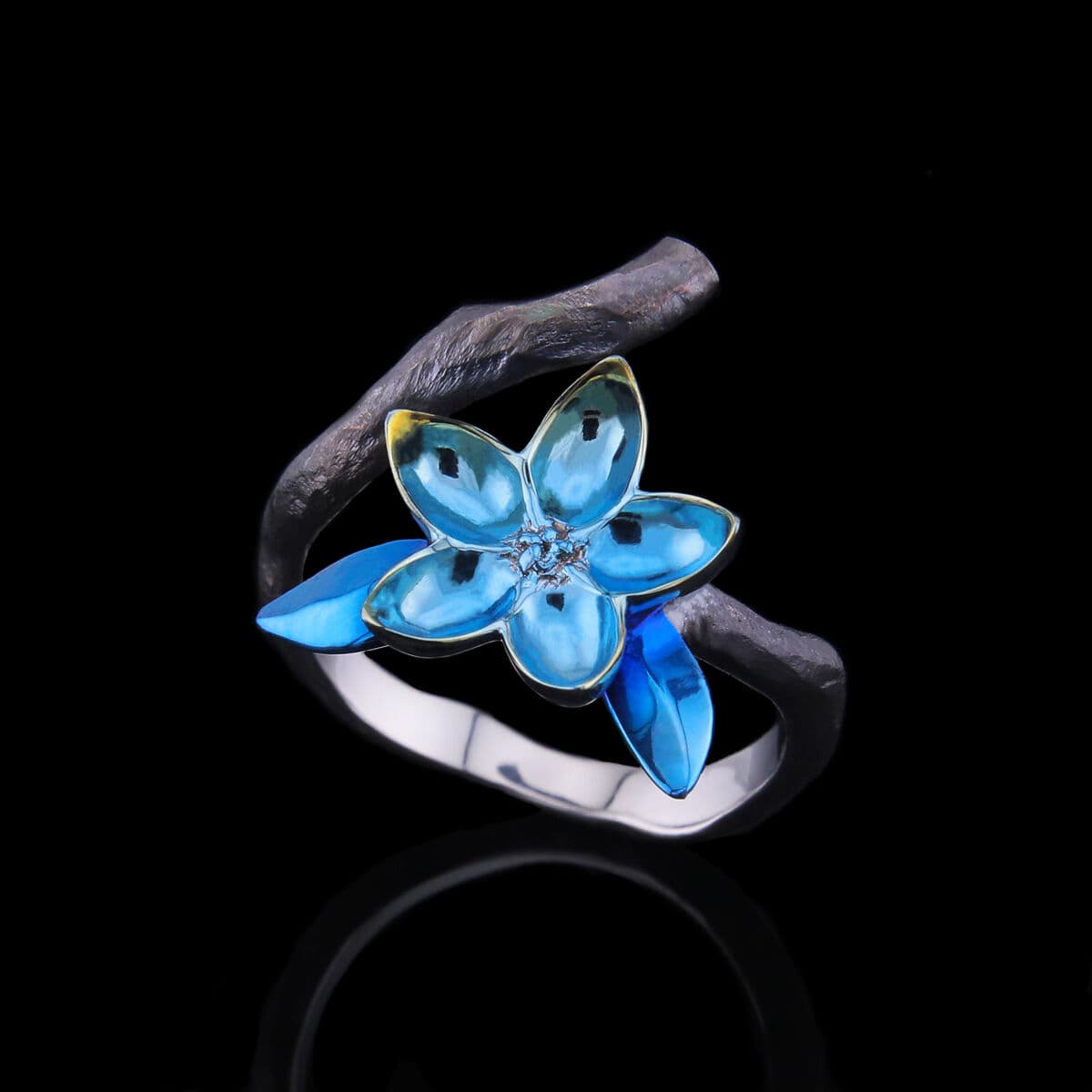Titanium ring — anodised blue flower detail